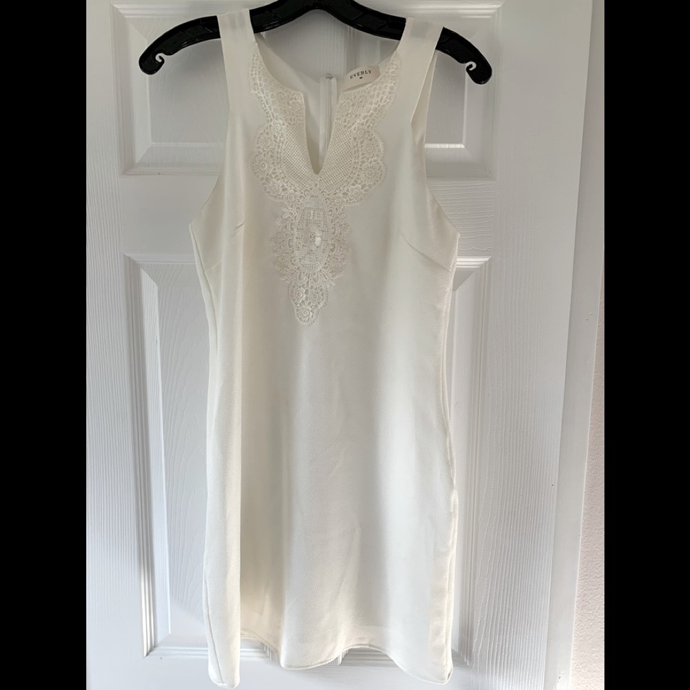 White v-neck dress with lace detail